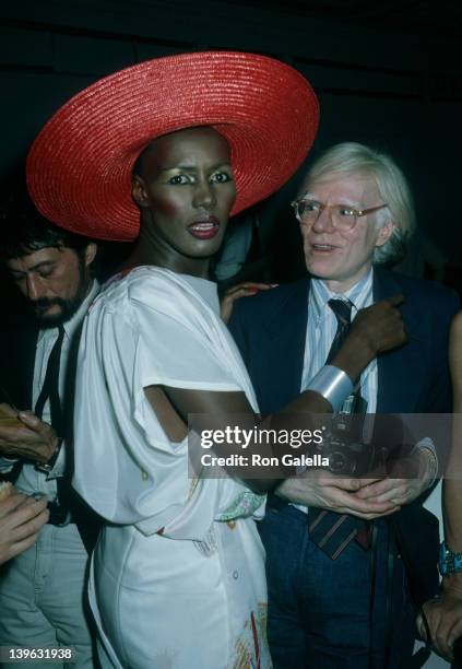 Grace Jones and Andy Warhol attend the premiere party for "Grease" on June 13, 1978 at Studio 54 in New York City.