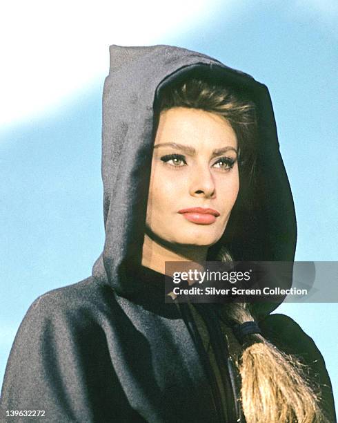 Sophia Loren, Italian actress, wearing a black cloak with the hood up over her head in a publicity portrait issued for the film, 'El Cid', 1961. The...