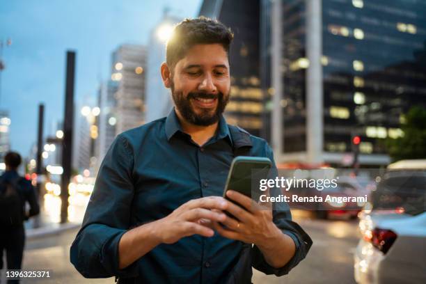 portrait of young man at avenida paulista, são paulo, brazil - play bus stock pictures, royalty-free photos & images