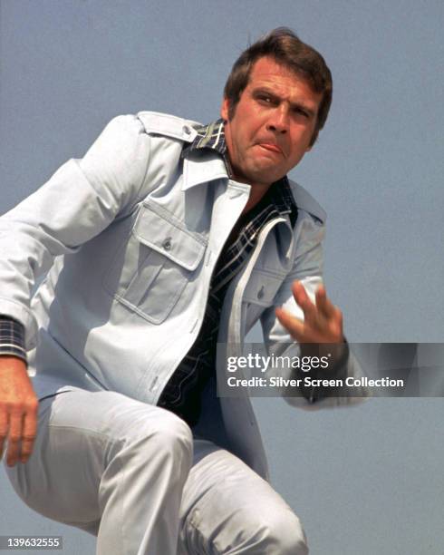 Lee Majors, US actor, wearing a white denim suit in a publicity portrait issued for the US television series, 'The Six Million Dollar Man', circa...