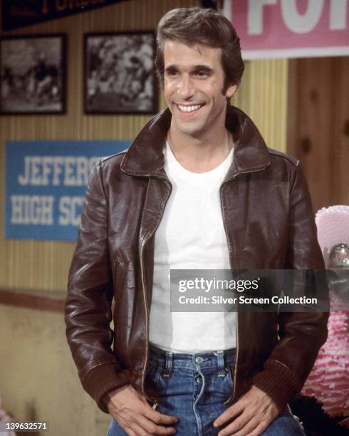 Henry Winkler, US actor, wearing a brown leather jacket and white t-shirt in a publicity still issued for the US television series, 'Happy Days',...