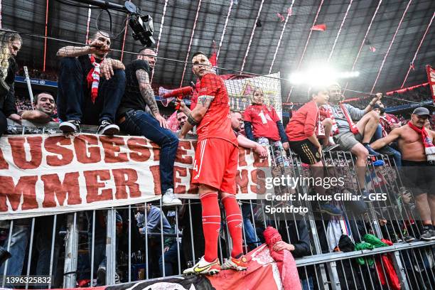 Niklas Suele of Munich celebrates winning the championship with the fans after the Bundesliga match between FC Bayern München and VfB Stuttgart at...