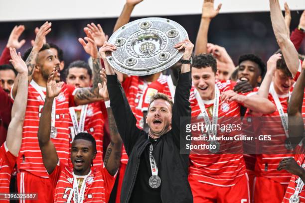 Head Coach Julian Nagelsmann of Munich lifts The Bundesliga Meisterschale trophy following their sides finish as Bundesliga champions after the...
