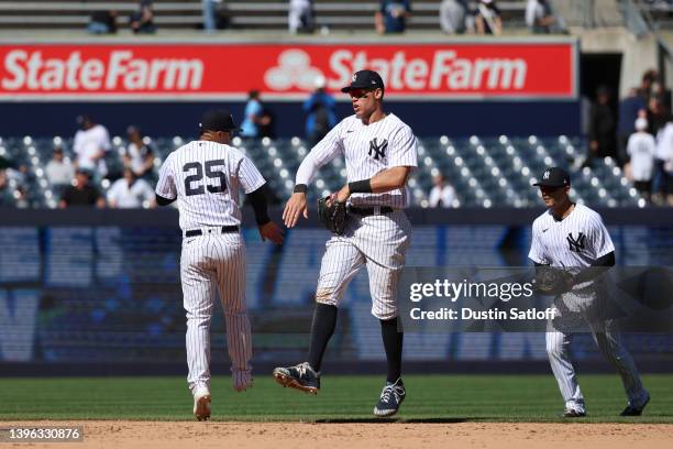 Aaron Judge and Gleyber Torres of the New York Yankees celebrate after a 1-0 win in the game against the Texas Rangers at Yankee Stadium on May 09,...