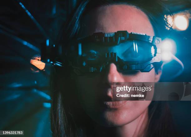 metaverse woman in futuristic neon city - city sensors stock pictures, royalty-free photos & images