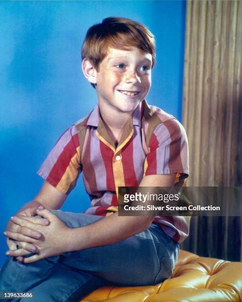 Bill Mumy, US child actor, wearing a striped shirt and blue denim jeans in a studio portrait, circa 1965.