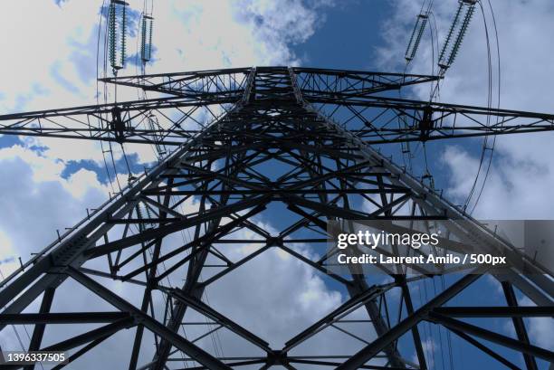 low angle view of electricity pylon against sky,france - componente elétrico imagens e fotografias de stock