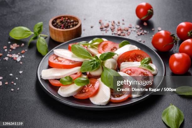 high angle view of food in plate on table - mozzarella stock-fotos und bilder