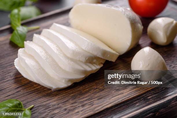 tasty fresh mozzarella cheese for making caprese salad - mozzarella stock-fotos und bilder