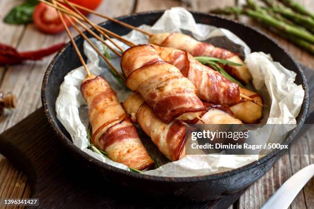 roll with bacon and chicken mince - bacon strip stock pictures, royalty-free photos & images