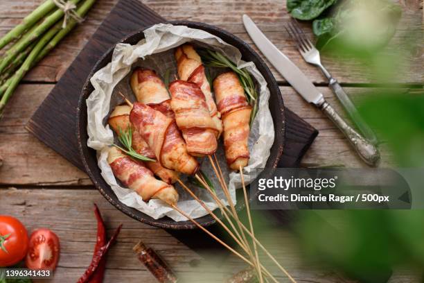 roll with bacon and chicken mince - bacon strip stock pictures, royalty-free photos & images