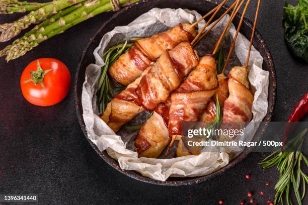 roll with bacon and chicken mince on a stew - bacon strip stock pictures, royalty-free photos & images