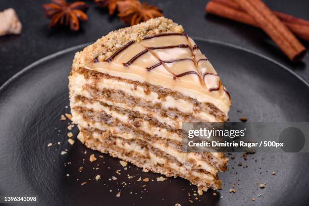 close-up of cake in plate on table - almond caramel stock-fotos und bilder