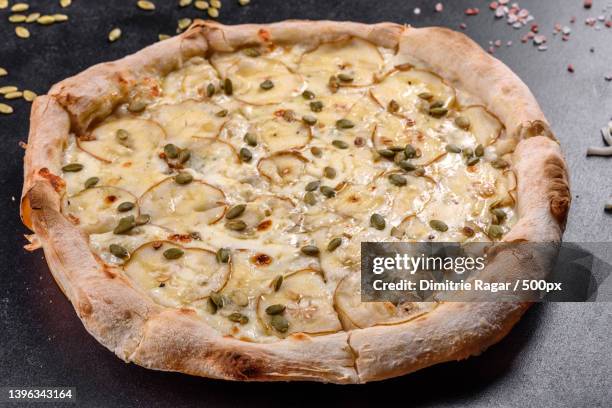 high angle view of pizza on table - gorgonzola stock pictures, royalty-free photos & images