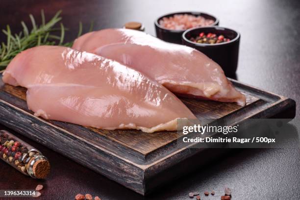 raw chicken fillet on a cutting board - kalkonbröst bildbanksfoton och bilder