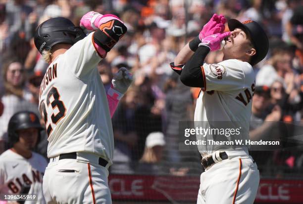 Mike Yastrzemski and Joc Pederson of the San Francisco Giants celebrates after Yastrzemski his a solo home run against the St. Louis Cardinals in the...