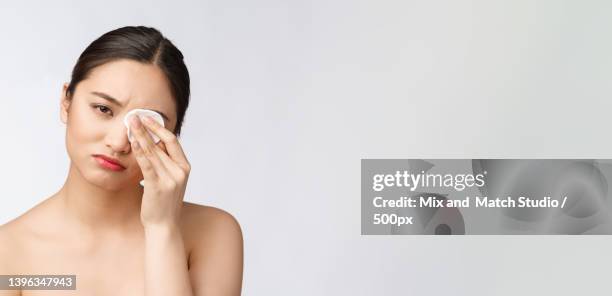skin care woman removing face makeup with cotton swab pad - skin care - cotton ball isolated stock pictures, royalty-free photos & images