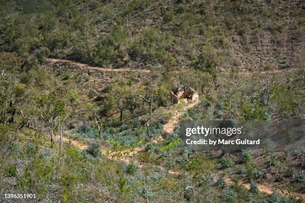 a ruined structure among an arid landscape along the rota vicentina hiking trail near porto covo in southwest portugal. - alentejo photos et images de collection