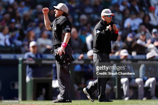 Umpire Chris Guccione calls for an out after a video replay during the game between the Seattle Mariners and the Tampa Bay Rays at T-Mobile Park on...