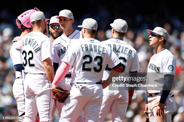 Pitching coach Pete Woodworth talks with George Kirby of the Seattle Mariners during Kirby's MLB debut against the Tampa Bay Rays at T-Mobile Park on...