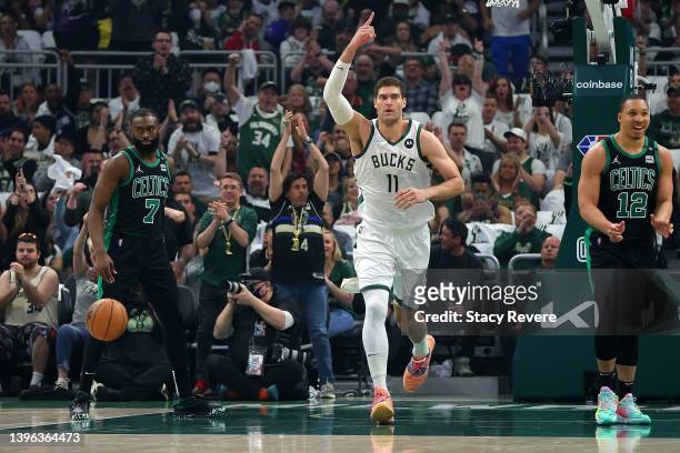 Brook Lopez of the Milwaukee Bucks reacts to a score against the Boston Celtics during the first quarter of Game 4 of the Eastern Conference...