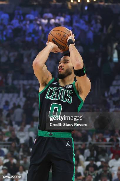 Jayson Tatum of the Boston Celtics takes a three point shot against the Milwaukee Bucks during the first quarter of Game 4 of the Eastern Conference...
