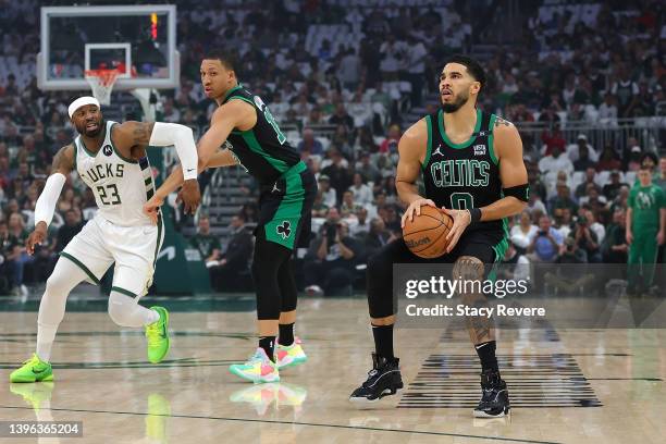 Jayson Tatum of the Boston Celtics takes a three point shot against the Milwaukee Bucks during the first quarter of Game 4 of the Eastern Conference...