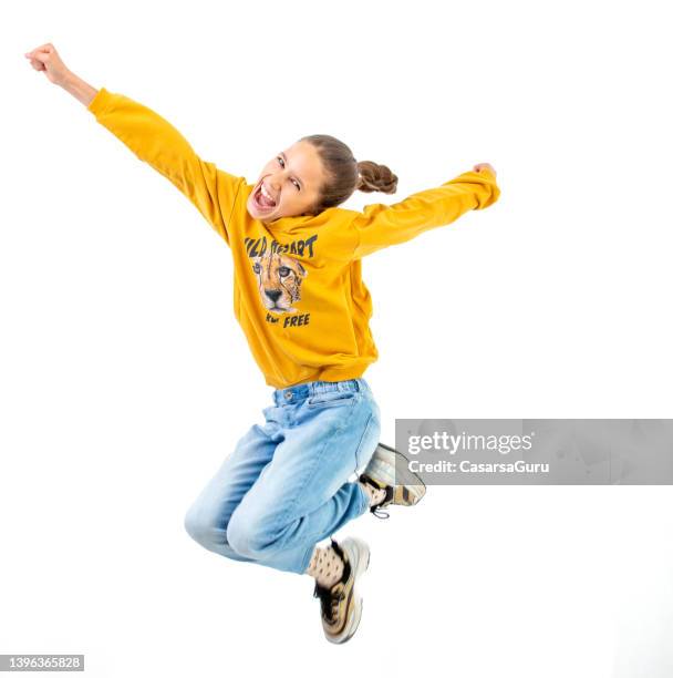 happy teen girl portrait mid-air - cardigan stock pictures, royalty-free photos & images