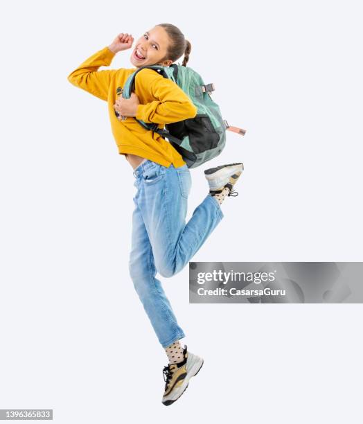 excited teen schoolgirl - jumping girl stock pictures, royalty-free photos & images