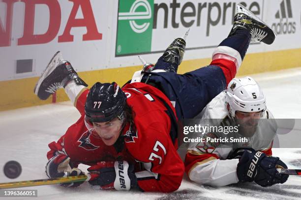 Oshie of the Washington Capitals and Aaron Ekblad of the Florida Panthers battle for the puck during the second period in Game Four of the First...