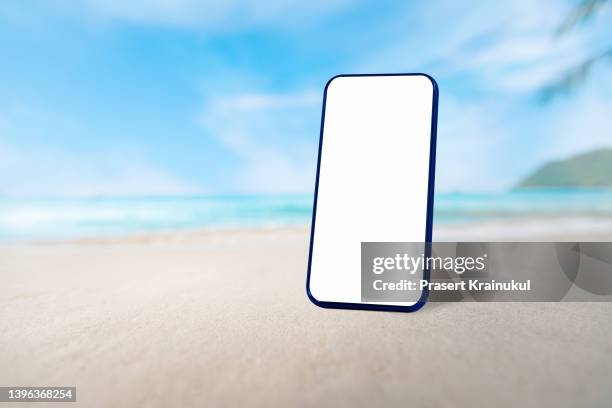 blank white smartphone on beautiful beach and sky - sea iphone stock pictures, royalty-free photos & images