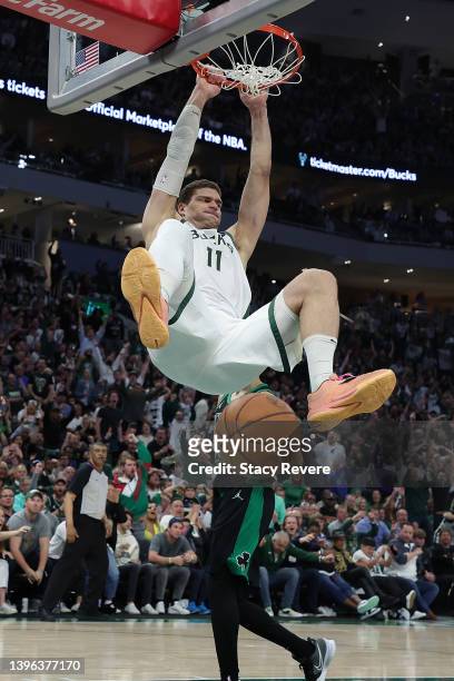 Brook Lopez of the Milwaukee Bucks dunks against the Boston Celtics during the second half of Game 4 of the Eastern Conference Semifinals at Fiserv...