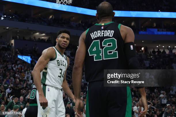 Giannis Antetokounmpo of the Milwaukee Bucks stares at Al Horford of the Boston Celtics following a score during the second half of Game 4 of the...