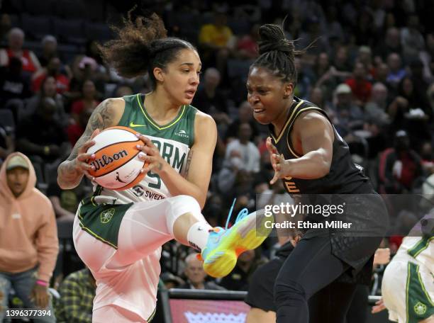 Gabby Williams of the Seattle Storm grabs a rebound against Chelsea Gray of the Las Vegas Aces during their game at Michelob ULTRA Arena on May 08,...