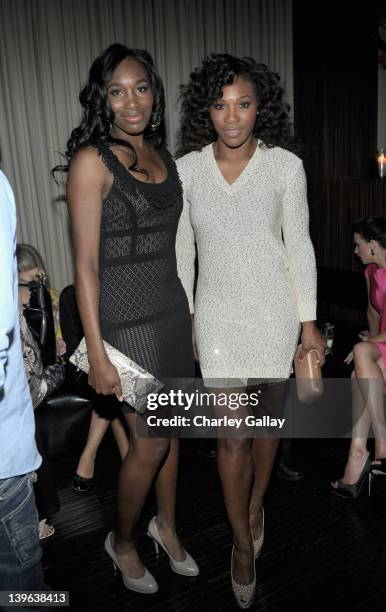 Professional tennis players Venus Williams and Serena Williams attend the Vanity Fair and Chrysler celebration of The Eva Longoria Foundation hosted...