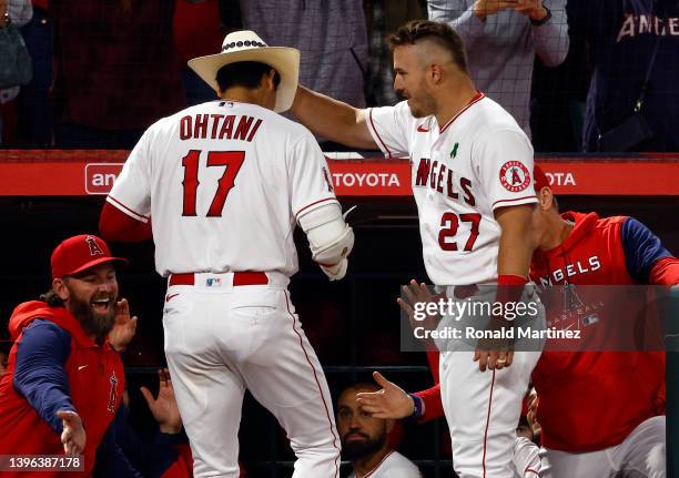 Shohei Ohtani and Mike Trout of the Los Angeles Angels celebrate a home run against the Tampa Bay Rays in the sixth inning at Angel Stadium of...