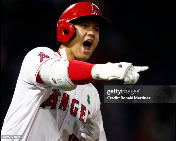 Shohei Ohtani of the Los Angeles Angels celebrates after hitting a grand slam against the Tampa Bay Rays in the seventh inning at Angel Stadium of...