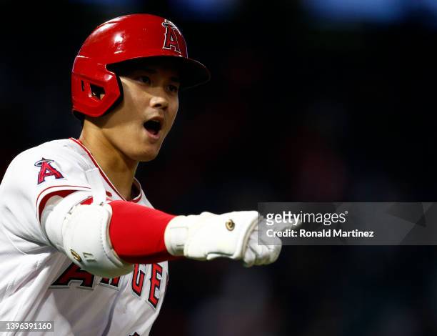 Shohei Ohtani of the Los Angeles Angels celebrates after hitting a grand slam against the Tampa Bay Rays in the seventh inning at Angel Stadium of...