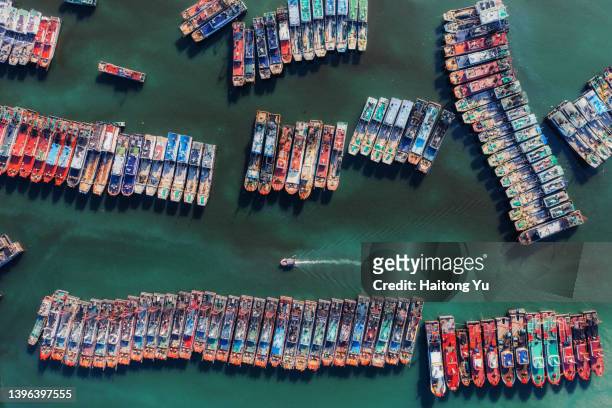 fishing harbour with densely-packed boats - south china sea stock pictures, royalty-free photos & images