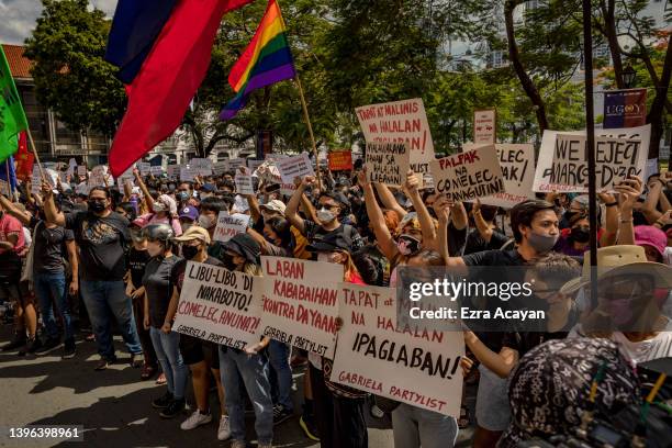 Filipinos take part in a protest against election results outside the Commission on Elections building on May 10, 2022 in Manila, Philippines....