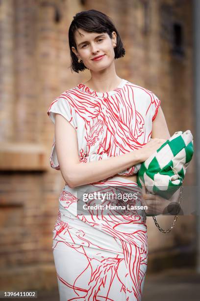 Chloe Hill is seen wearing Christopher Esber dress and green leather clutch at Afterpay Australian Fashion Week 2022 on May 10, 2022 in Sydney,...