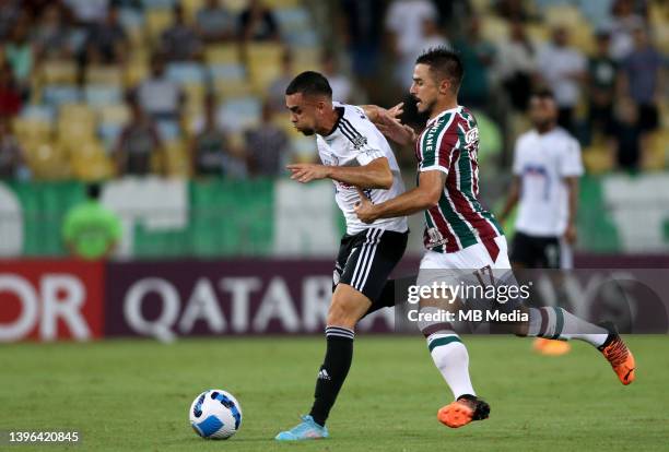 Willian Bigode of Fluminense competes for the ball with Daniel Giraldo of Junior Barranquilla during the match between Fluminense and Junior...