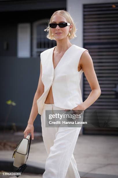 Lauren Burns wearing white vest and pants at Afterpay Australian Fashion Week 2022 on May 10, 2022 in Sydney, Australia.