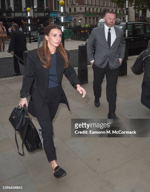 Coleen Rooney and Wayne Rooney arrive at the Royal Courts of Justice, Strand on May 10, 2022 in London, England. Coleen Rooney, wife Derby County...