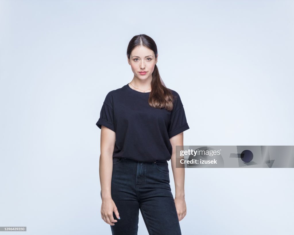 Confident woman against white background