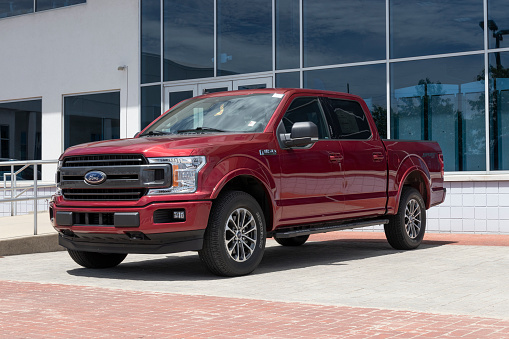 Ford F-150 display at a dealership. The Ford F150 is available in XL, XLT, Lariat, King Ranch, Platinum, and Limited models.