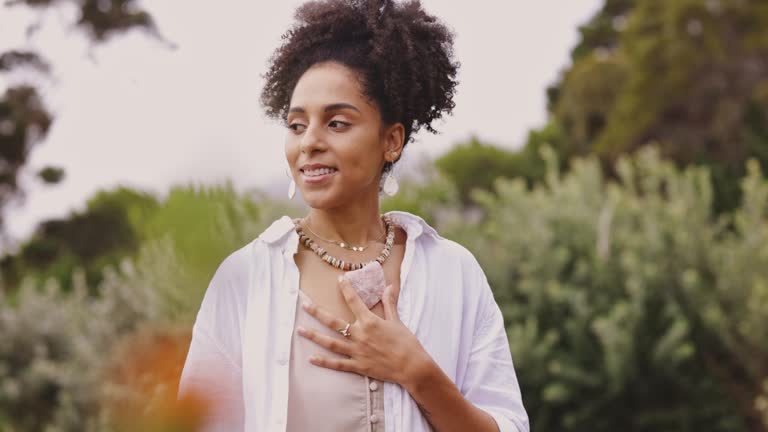 https://media.gettyimages.com/id/1396444860/video/young-woman-with-curly-hair-breathing-in-the-fresh-air-while-meditating-with-a-rose-quartz.jpg?b=1&s=640x640&k=20&c=5sRHMZLXxifWmLnQcmCeWgDURaPSIR0EbvN7YD1Ibec=