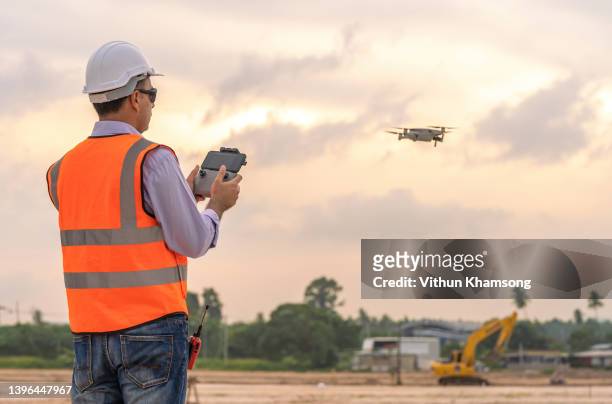 surveyor and drone for survey  on construction site, land and soil development, survey equipment,civil engineer. - drone pilot stock pictures, royalty-free photos & images