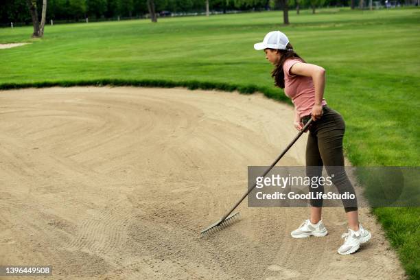 sand trap maintenance - golf course maintenance stock pictures, royalty-free photos & images