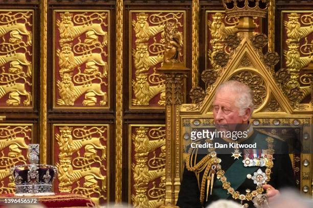 Prince Charles, Prince of Wales looks towards the Imperial State Crown as he delivers the Queen’s Speech during the state opening of Parliament at...